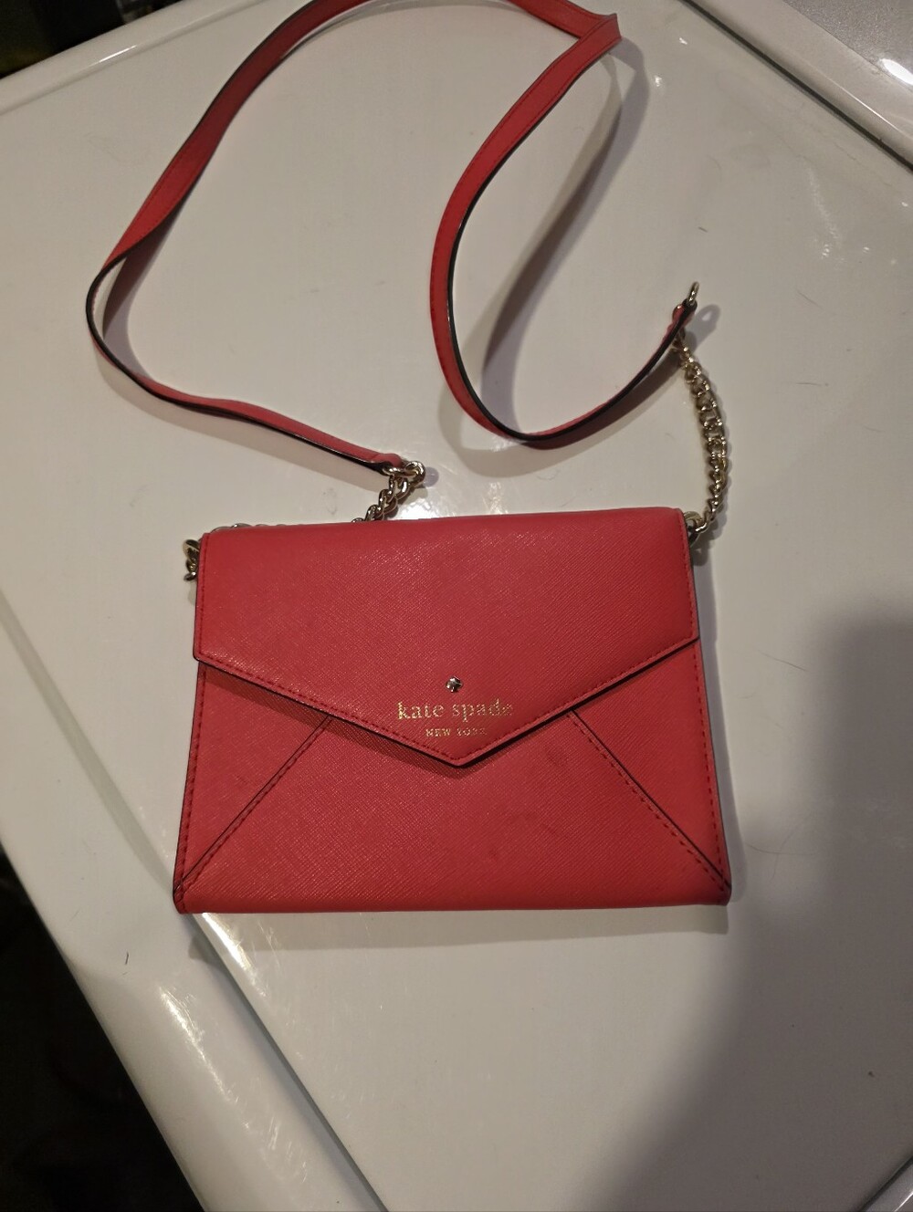 Kate Spade New York Saffiano Leather Envelope Crossbody Bag in Vibrant Red